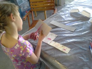 Sierra cutting her puzzle pieces