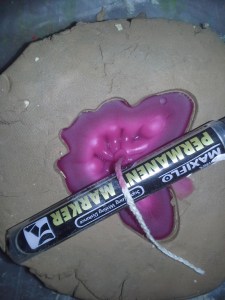 Butterfly hardening, permanent marker holding the wick in place